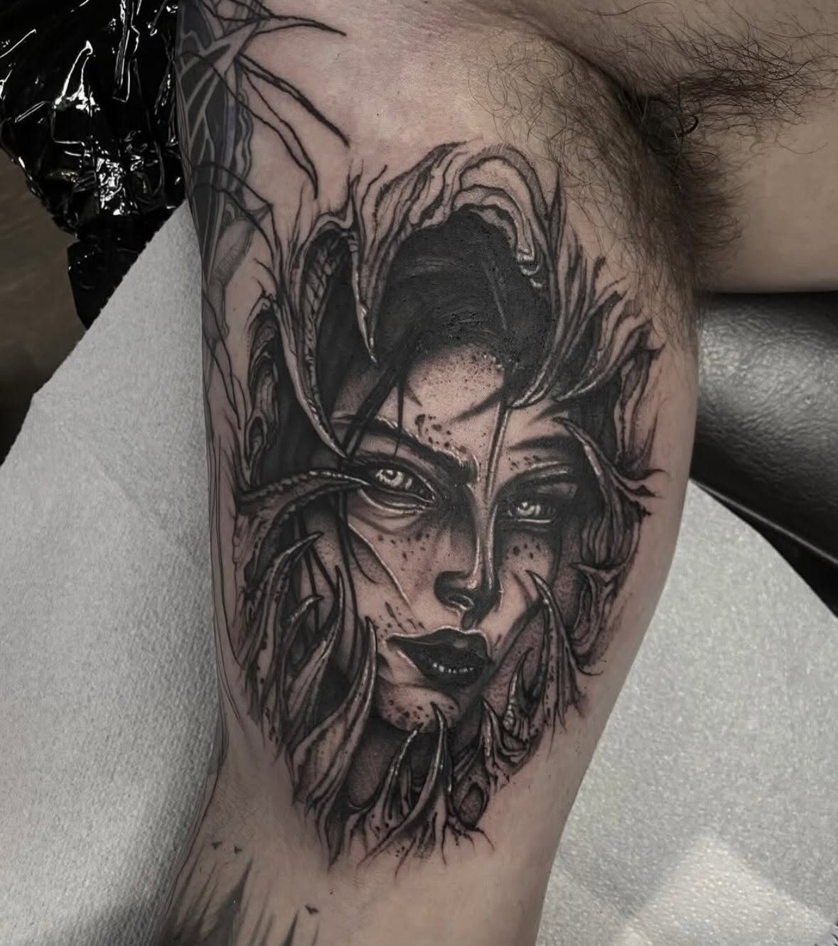 Dark female portrait tattoo